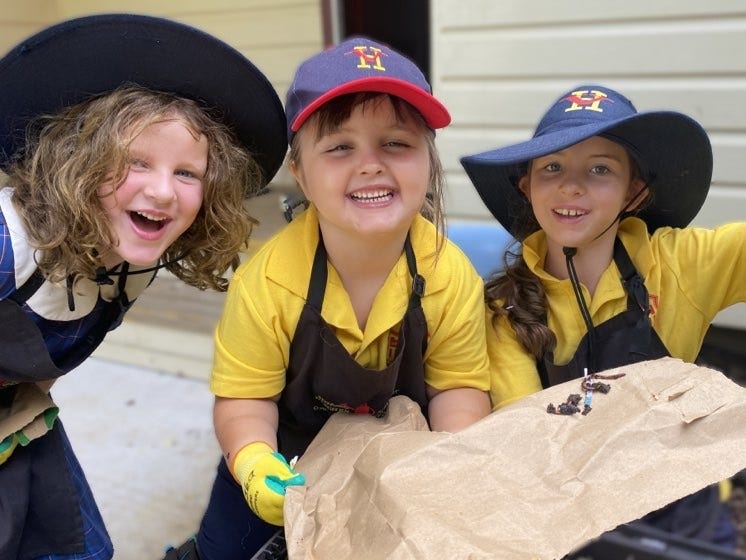 A photo of students laughing and smiling at school.