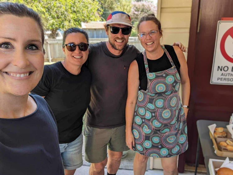 A photo of parents volunteering at a school event.